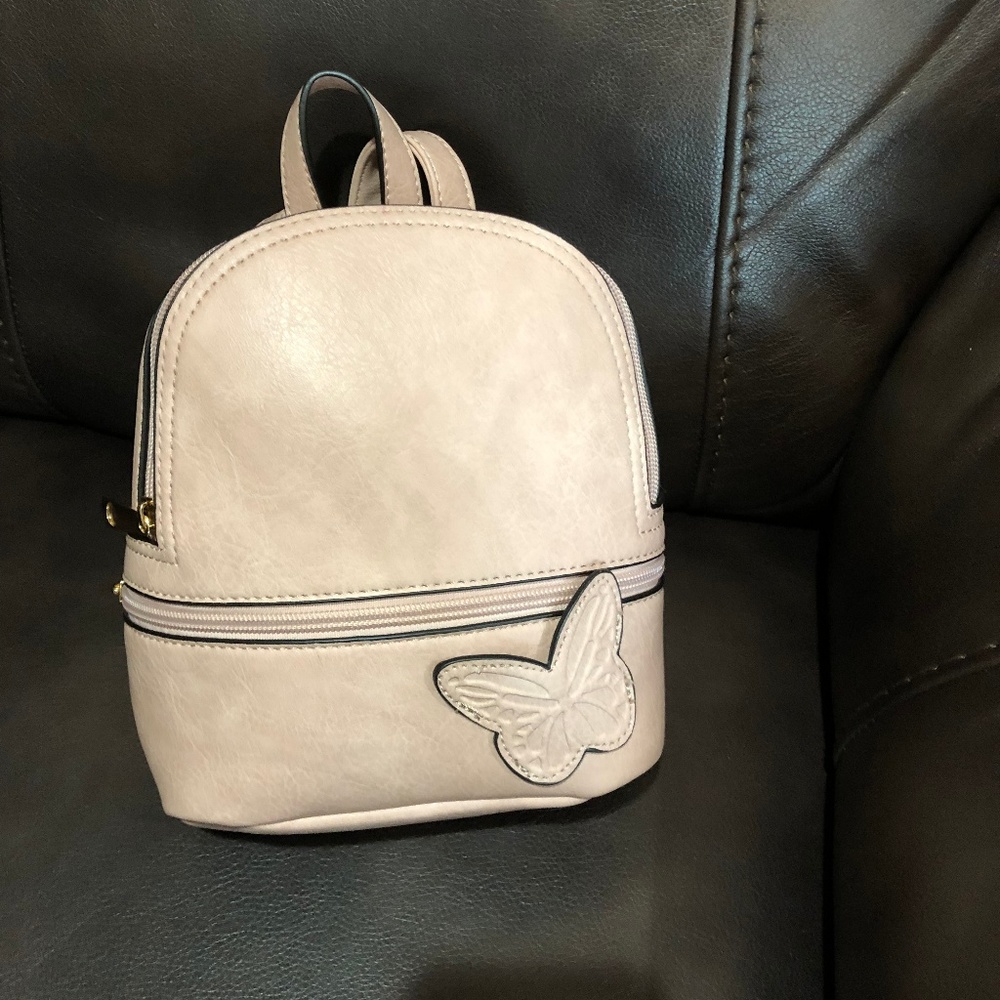 Pink small backpack with butterfly design
